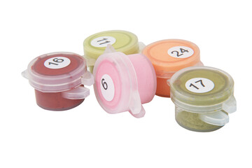 Paints in mini bottles for drawing by numbers isolated on the white background