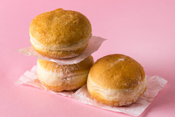 Three Berliner Doughnuts European Donuts Tradicional Bakery for Fasching Carneval Time Vertical Pink Background