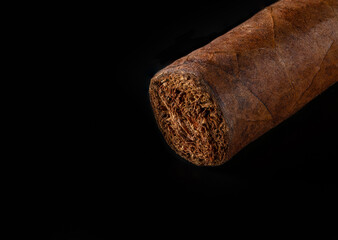 Cuban cigar with great detail. On an isolated black background. Studio photography.