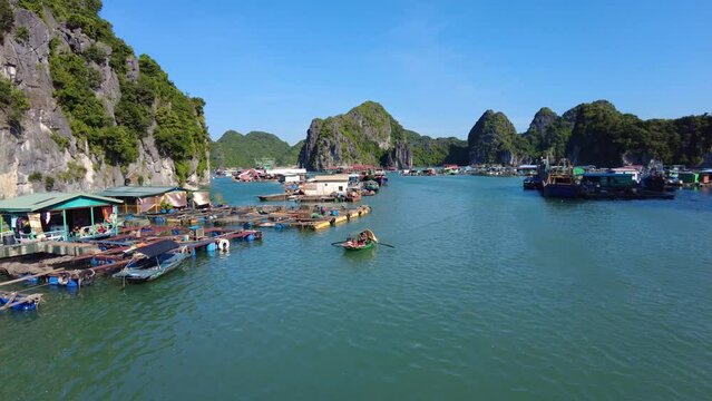 Cat Ba, Vietnam: Tour boat sailing around the floating village near the Cat Ba island in the famous Halong bay in the Gulf of Tonkin in Northern Vietnam. 