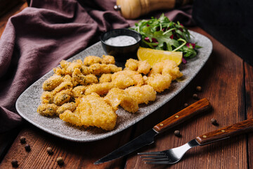 Shrimps, crab legs and mussels fried in batter