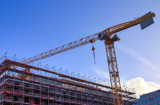 Kiel, Germany - 27.December 2022: Several cranes on constructions sites at high buildings.