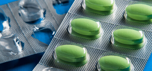 Banner on medical theme. Medicinal tablets in a package close-up, medicinal blisters. Soft focus