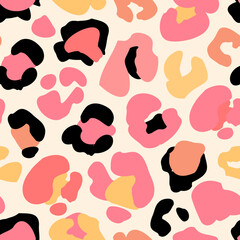 Animal skin print in 90s style. Colorful leopard spot seamless pattern design.