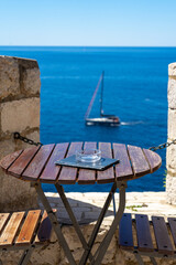 A table in a cafe overlooking the blue sea