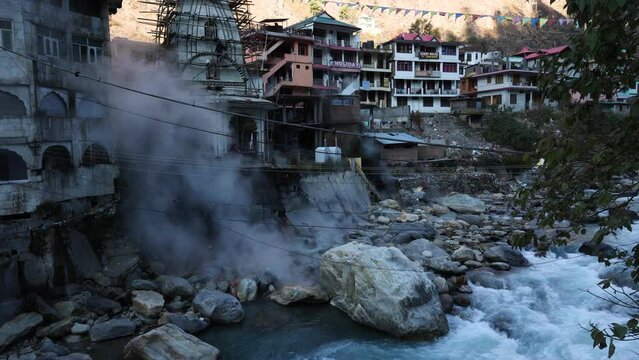 Hot water spring in Manikaran Kullu Manali Himachal Pradesh India. Pilgrimage center for both Hindus and Sikhs  Sahib Gurudwara.  Shiva temple in Kasol village along the banks of the Parvati river.