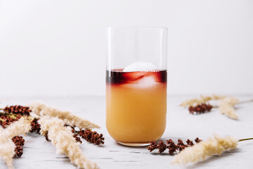 Glass of tasty coffee with orange juice