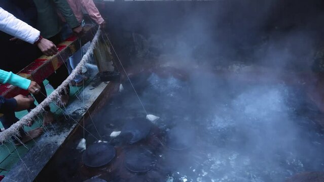 Hot water spring in Manikaran Kullu Manali Himachal Pradesh India. Pilgrimage center for both Hindus and Sikhs  Sahib Gurudwara.  Shiva temple in Kasol village along the banks of the Parvati river.