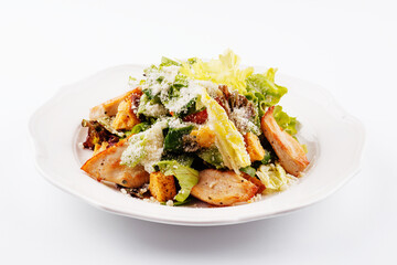 Traditional classic Caesar salad in white plate