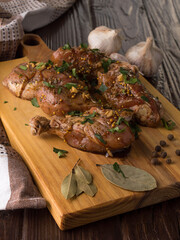 marinated chicken meat in soy sauce on a wooden board.