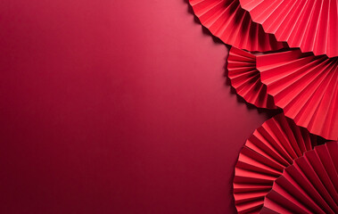 Traditional Chinese new year background concept made from red paper fan.