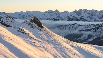 Kleinwalsertal in the Allgäu Alps in winter at sunrise with fresh snow