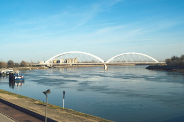 New railway and transport bridge across the Danube river in Novi Sad, Serbia and calm river