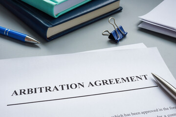 Papers with arbitration agreement and a pen. - obrazy, fototapety, plakaty