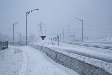 Road under the snow. Impossibility to take a vehicle. Snow storm. Transport not possible with snow. Road covered with snow in the middle of a storm, blizzard, winter. Difficult movement