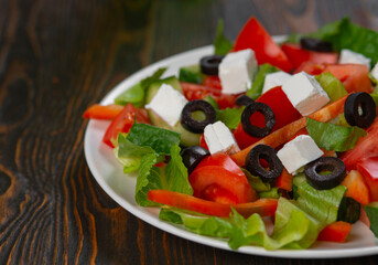 Traditional Greek salad with feta, olives and vegetables
