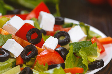 Traditional Greek salad with feta, olives and vegetables