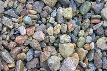 Crushed close up different granite stone texture background.