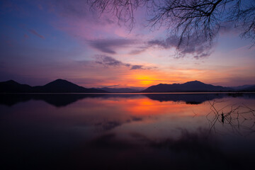 Fototapeta na wymiar evening light after sunset at Lam Taphan Reservoir Suphanburi Province, Thailand