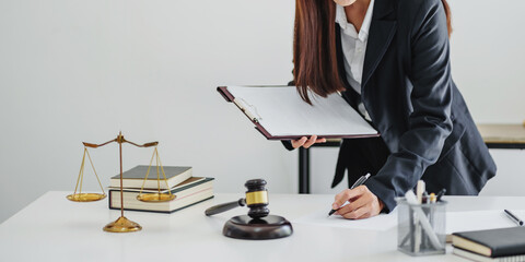 Lawyer businesswoman working with consult. Legal law Judge Gavel Scale of Justice concept.
