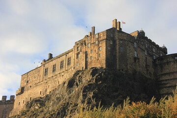 Edinburgh Castle at sunrise with the Union Jack flag in Scotland