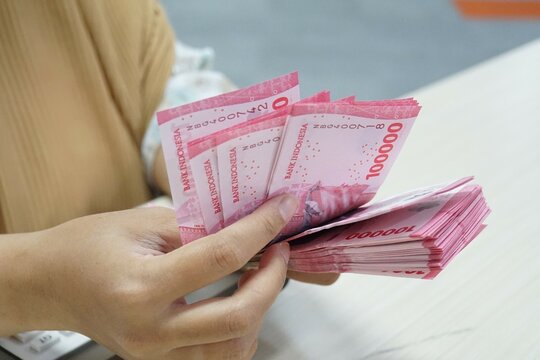 New Indonesian rupiah banknotes series with the value of one hundred thousand rupiah IDR 100.000. Indonesian rupiah for background.