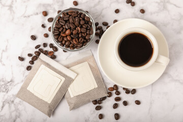 Making drip coffee with a special taste. Drip coffee bag in a coffee cup. Trends in brewing coffee at home.