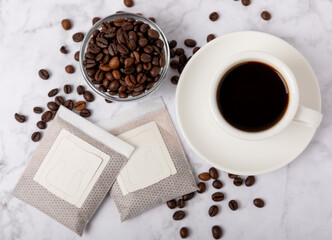 Making drip coffee with a special taste. Drip coffee bag in a coffee cup. Trends in brewing coffee at home.