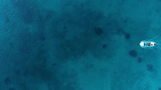 drone shot bird's eye view of fishing boat in the sea
