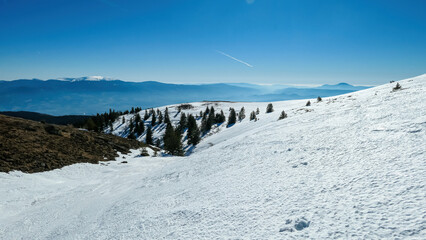 Scenic view of snow covered alpine meadows and Koralpe mountains seen from Ladinger Spitz, Saualpe,...
