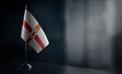 Small national flag of the Northern Ireland on a black background