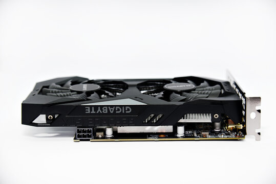 A video game card with two fans. A tool for mining. Accessories for a personal computer. Black graphics card on a white background.
