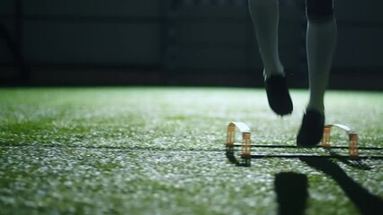 legs of training man in football club, closeup in sport arena, professional african soccer player