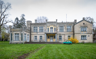 Fototapeta na wymiar The neo-Gothic palace in the village Arcugowo, a manor house from 1815 founded by Michał Roznowski. Poland