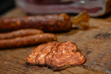 dried sausage on a wooden board