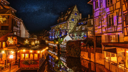Colmar, Petit Venice, at dusk water canal and traditional colorful houses. Alsace, France.	