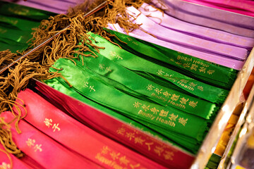 Wish ribbons in Buddhist temple in Kek Lok Si temple, George Town, Penang, Malaysia. Translation:...