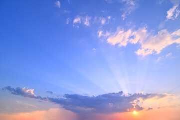 Fototapeta premium sunset or sun rise sky with rays of light shining clouds and sky background and texture