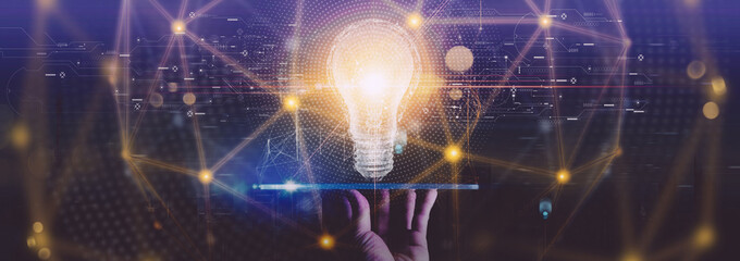 Creativity on connectivity.Innovative idea.Inspiration and network. Hand holding digital tablet light bulbs as symbol of innovation on global city network connection.