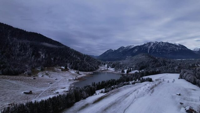 DRONE AERIAL FOOTAGE: The Lake Geroldsee and the Karwendel mountains, the largest mountain range of the Northern Limestone Alps, near Garmisch-Partenkirchen and Mittenwald, Krun, Bavaria, Germany.
