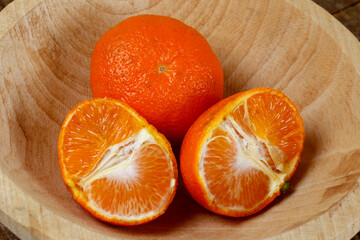 Mandarine, or mexerica in Portuguese, on wooden background