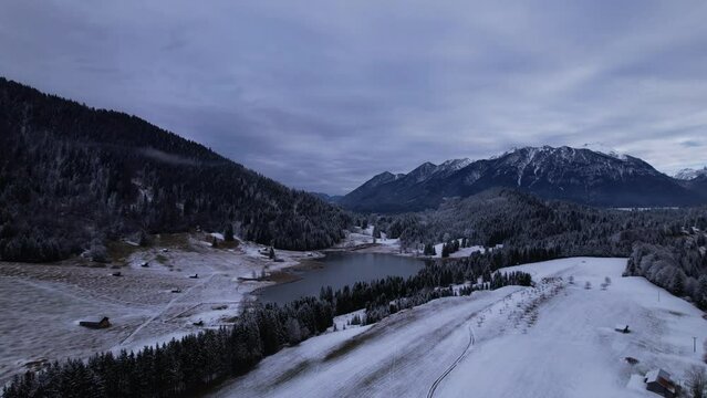 DRONE AERIAL FOOTAGE: The Lake Geroldsee and the Karwendel mountains, the largest mountain range of the Northern Limestone Alps, near Garmisch-Partenkirchen and Mittenwald, Krun, Bavaria, Germany.
