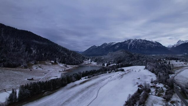 DRONE AERIAL FOOTAGE: The Lake Geroldsee and the Karwendel mountains, the largest mountain range of the Northern Limestone Alps, near Garmisch-Partenkirchen and Mittenwald, Krun, Bavaria, Germany.