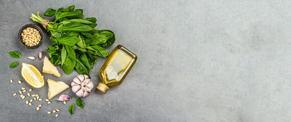 Fototapeta na wymiar Traditional ingredients for the preparation of classic Italian basil pesto. Fresh leaves, olive oil