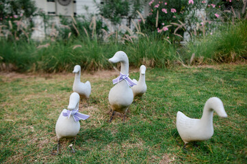 Statues in various postures placed in the garden