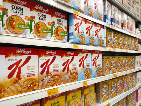 MELAKA, MALAYSIA -OCTOBER 1, 2022: Cereals of various flavors from various brands as a breakfast food. Packed in a commercial paper box and displayed for customers. Each item has a price tag.
