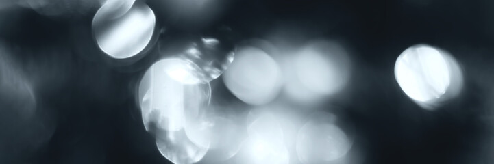 Blurred lights, gray, deep blue background, banner texture. Abstract bokeh with soft light header. Wide screen wallpaper. Panoramic web banner with copy space for design