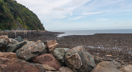Sea Defence/An image of large rocks forming a sea defence on the North Devon coastline, England, UK