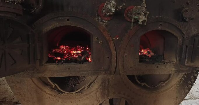 Closeup of charcoal burning inside the factory kiln