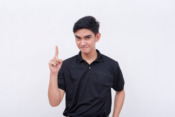 A sly man explaining his devious plan. Gesturing with his index finger, pointing upwards. Isolated on a white background.